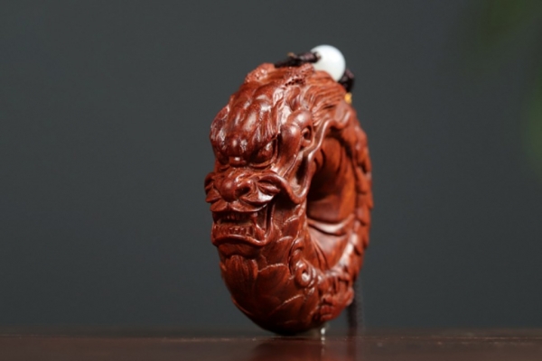 圆龙紫檀手把件