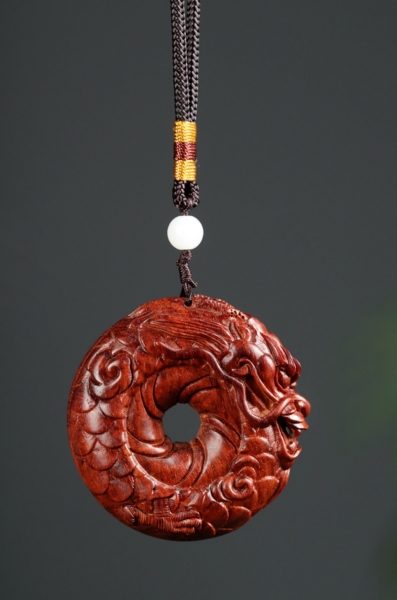 圆龙紫檀手把件